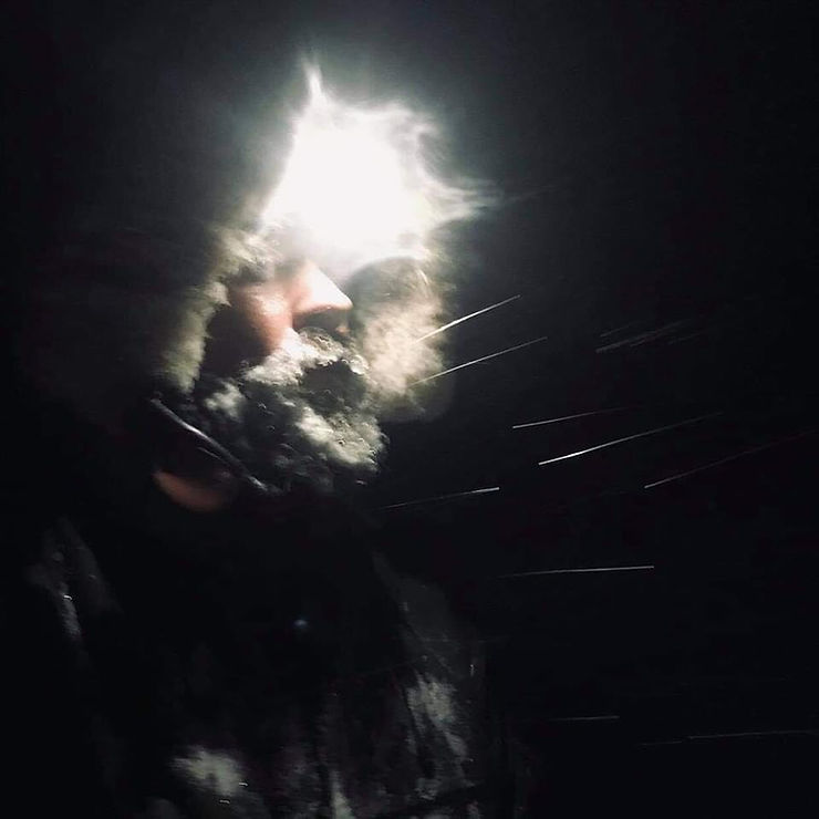 Mushing through the darkness and snow