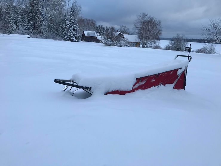 Deep snow accumulation outside the cabin